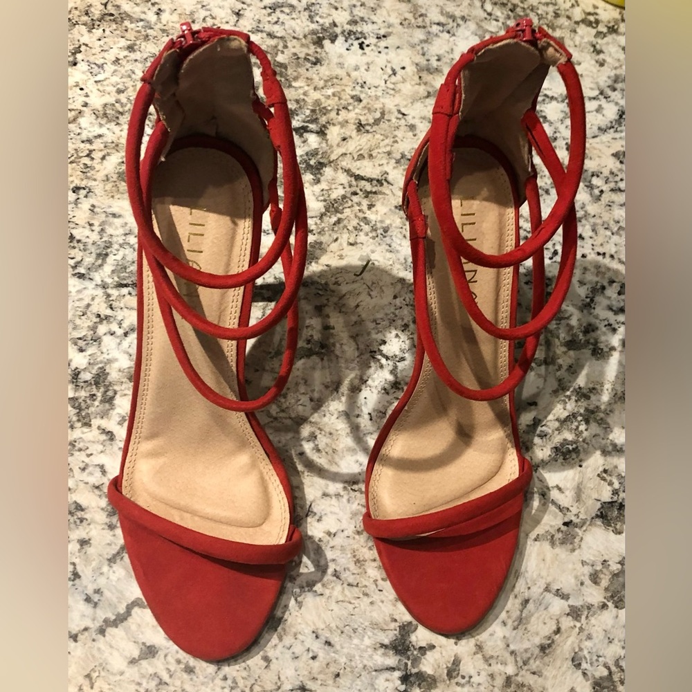gently used red heels in size 8 by Lilian